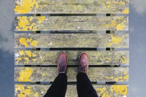 pair brown leather shoes standing old grey yellow bridge